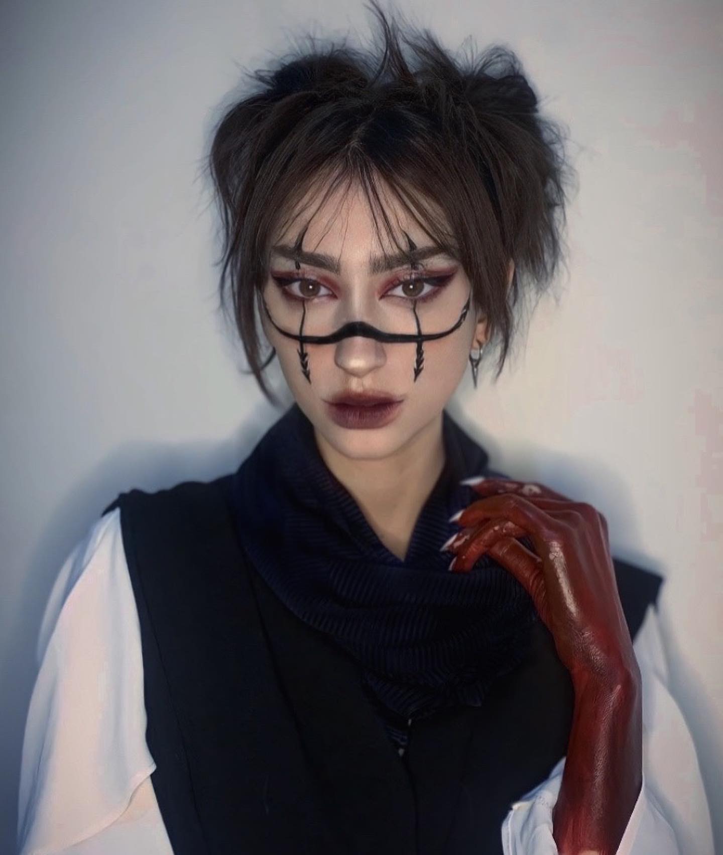 Choso cosplay transformation with marked skin and a red hand